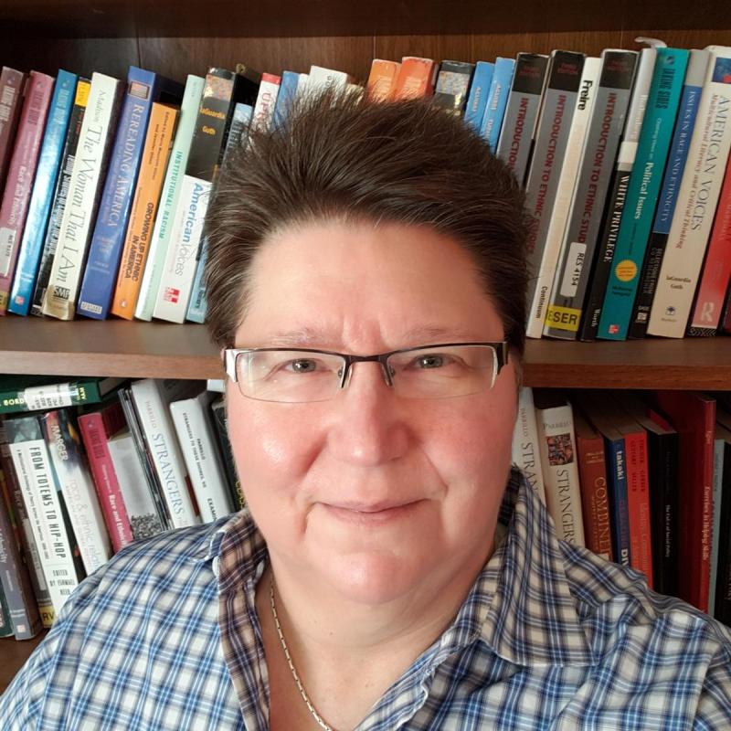 Picture of Mary Churchill with books behind 